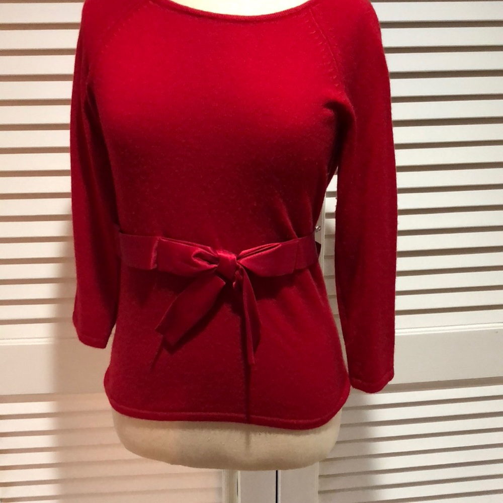 Red cashmere sweater.